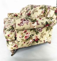 SOFA BY HANCOCK AND MOORE, country house style rose print with arched back, scroll arms, turned