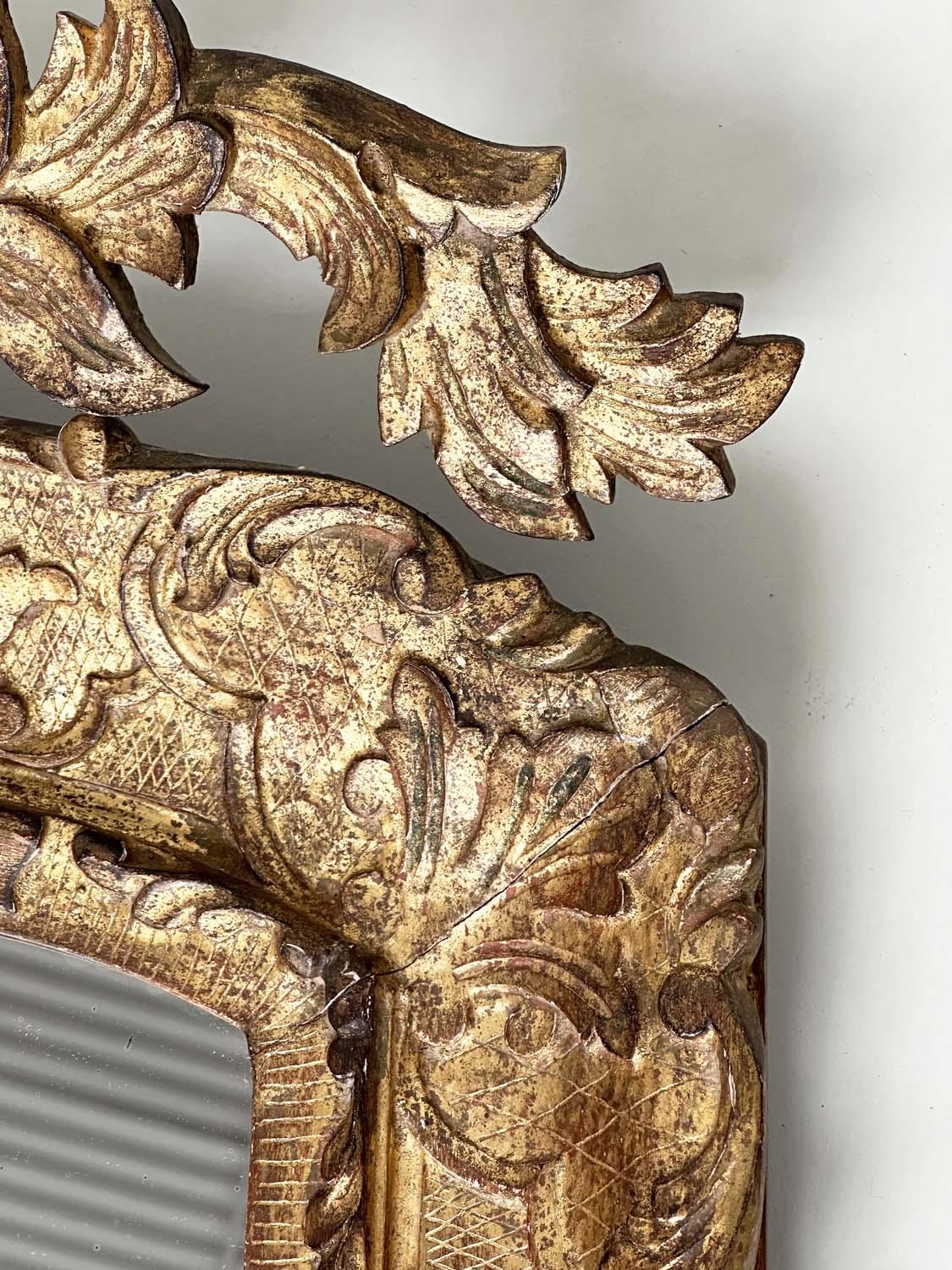 WALL MIRROR, early 19th century Italian carved giltwood grotto style arched with foliate crest, 76cm - Image 9 of 10