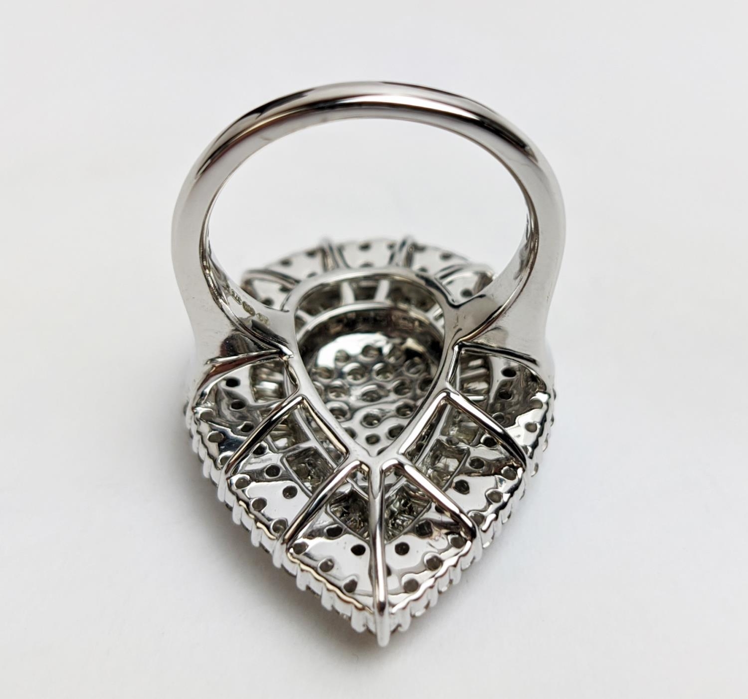 A 9CT WHITE GOLD DIAMOND CLUSTER DRESS RING, tear-drop shape, set with a baguette and round - Image 8 of 12