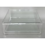 LUCITE LOW TABLE, square glazed raised upon lucite supports with undertier, 90cm x 90cm x 38cm.