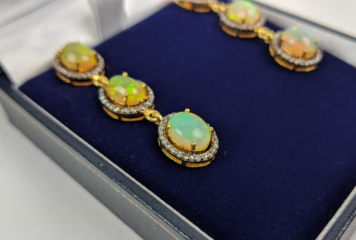 A PAIR OF SILVER-GILT OPAL AND DIAMOND SET PENDANT EARRINGS, of triple sectioned droplet form, - Bild 3 aus 7
