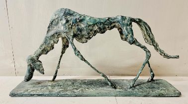 FIGURE OF A DOG, bronze abstract form in a standing position, 30cm H x 60cm L x 13cm D.