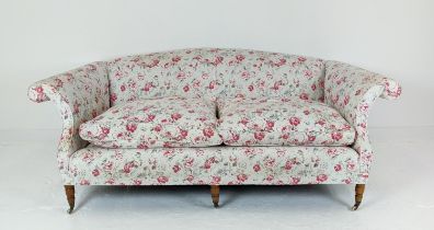 SOFA, three seater, upholstered in Cath Kidson fabric with turned front supports and castors,