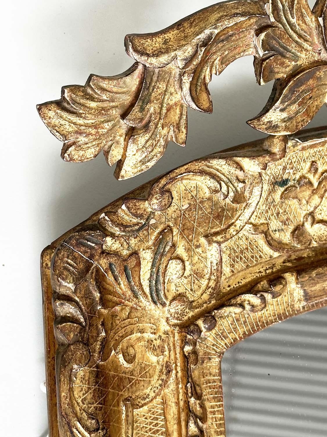 WALL MIRROR, early 19th century Italian carved giltwood grotto style arched with foliate crest, 76cm - Image 6 of 10