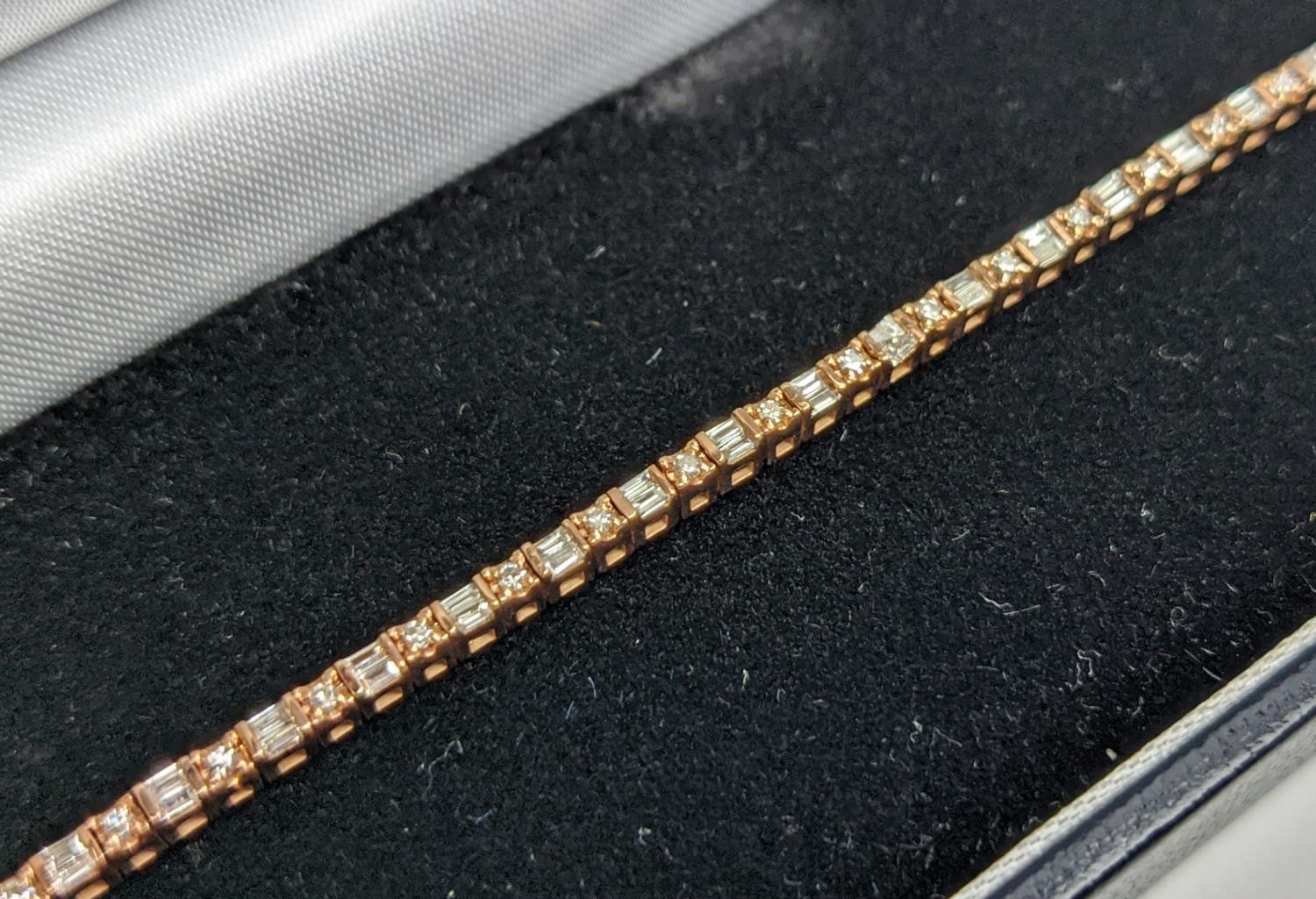 A 10CT ROSE GOLD AND DIAMOND SET BRACELET, set with alternating baguette and round brilliant cut - Image 4 of 9