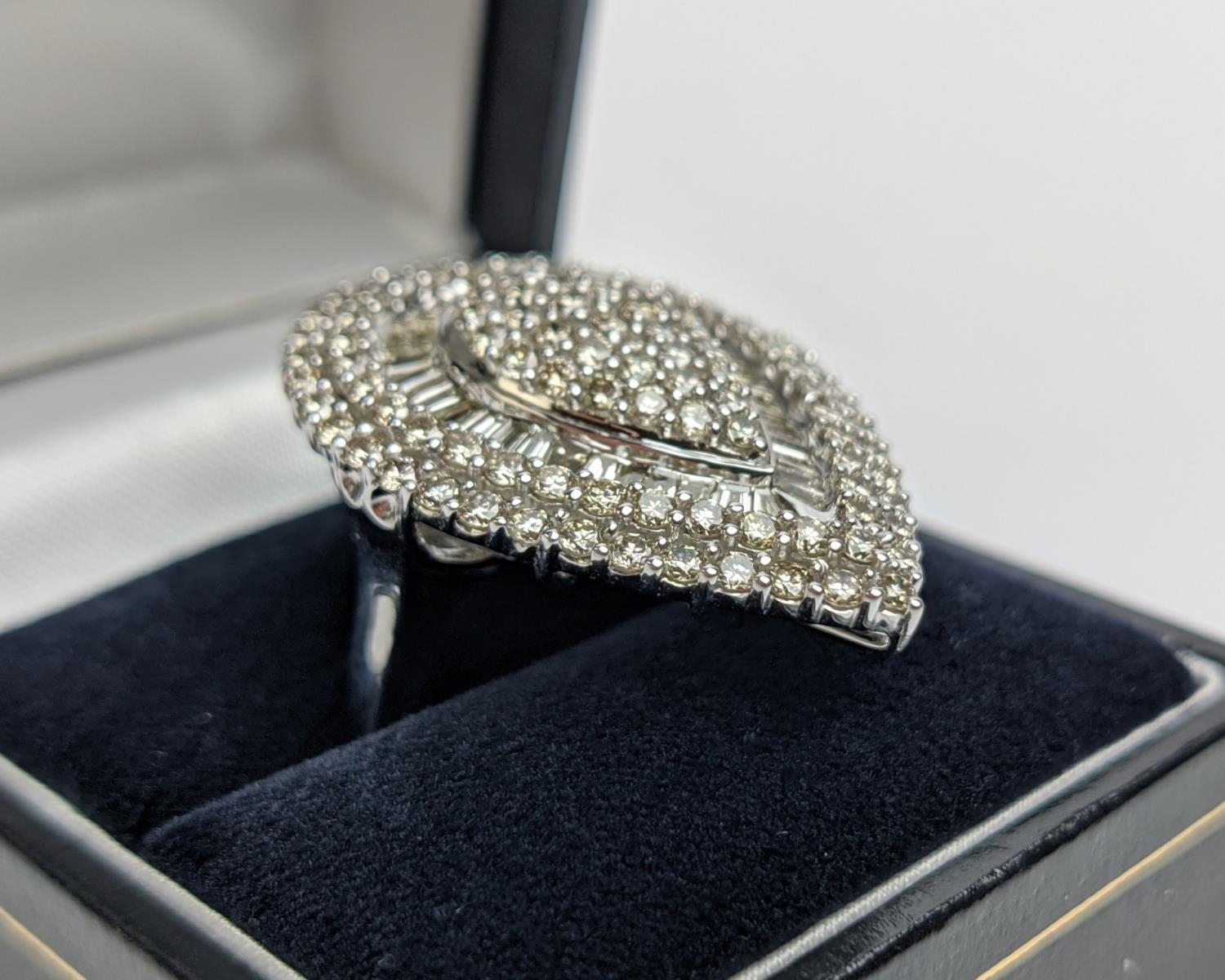 A 9CT WHITE GOLD DIAMOND CLUSTER DRESS RING, tear-drop shape, set with a baguette and round - Image 5 of 12