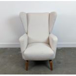 WING ARMCHAIR, circa 1970, in boucle wool upholstery, 98cm H x 72cm W x 86cm D.