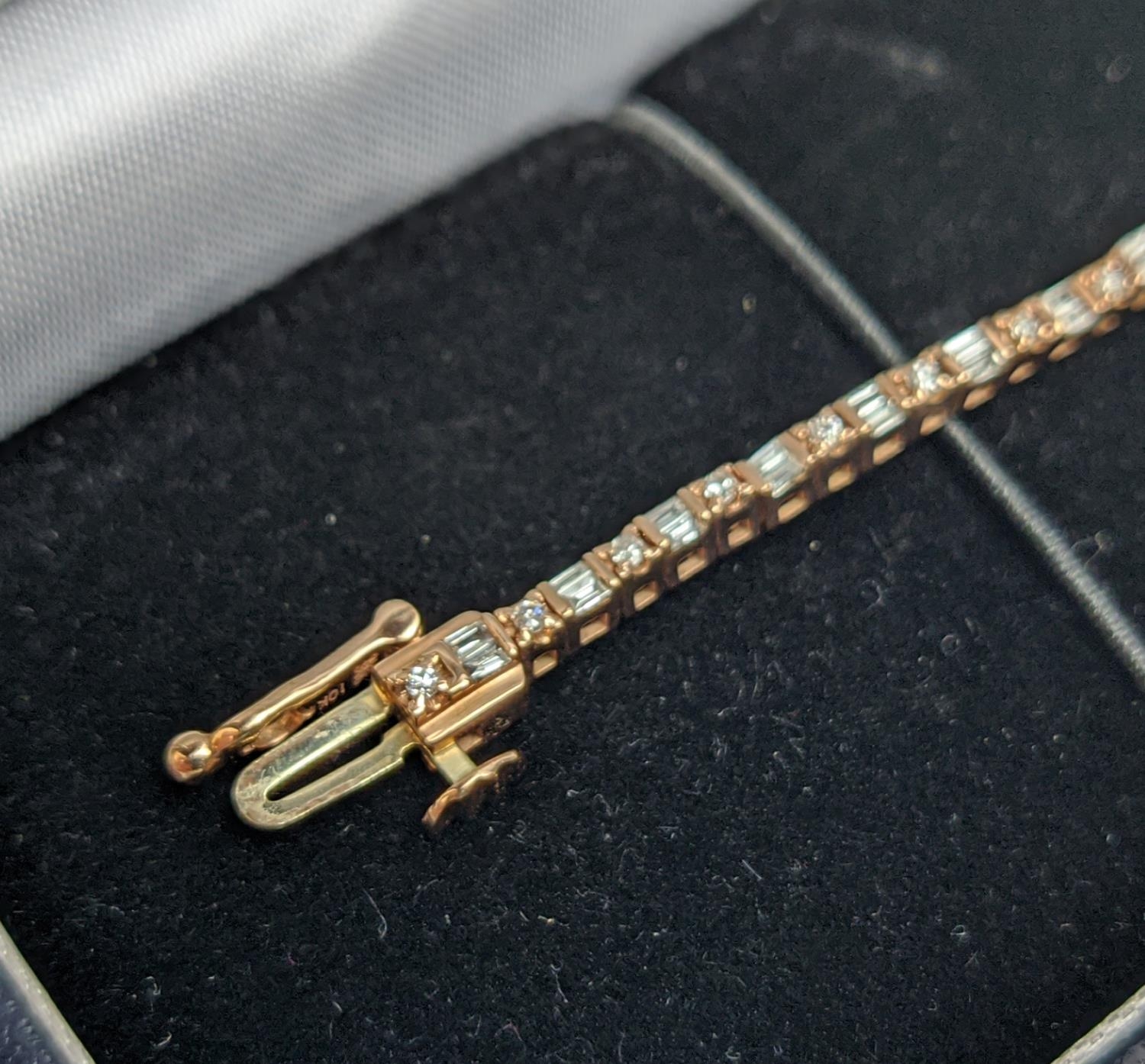 A 10CT ROSE GOLD AND DIAMOND SET BRACELET, set with alternating baguette and round brilliant cut - Image 3 of 9