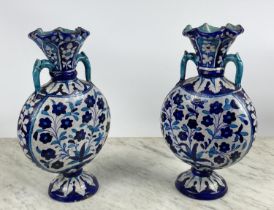 SIND POTTERY MOONFLASK VASES, a pair, 19th century decorated in blue and turquoise enamels with