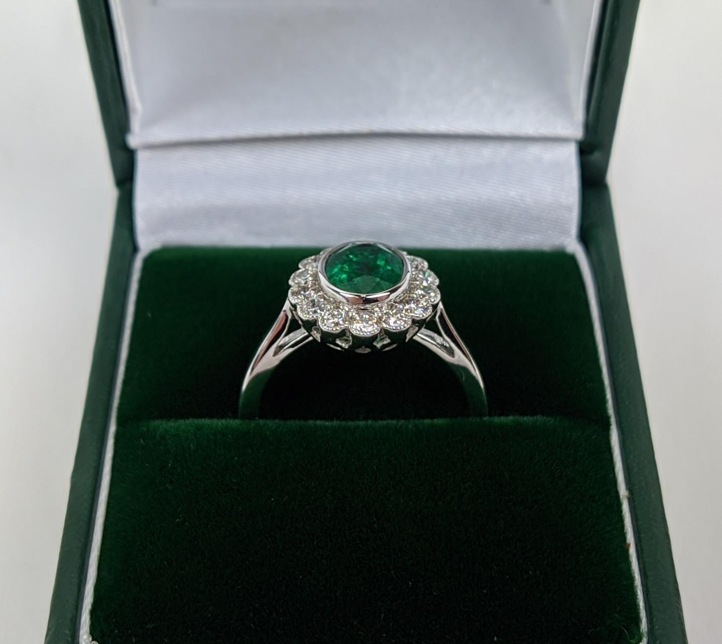 AN 18CT WHITE GOLD EMERALD AND DIAMOND DRESS RING, the central emerald of approximately 1.60 carats, - Bild 9 aus 9