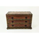 CHEST, Spanish style tan leather clad and brass bound with three drawers, 59cm H x 95cm W x 46cm D.