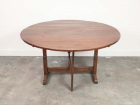 VENDANGE TABLE, 19th century French walnut with circular tilt top, 74cm H x 129cm D.