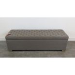 OTTOMAN, with a grey buttoned rising lid, 147cm x 48cm x 46cm H.