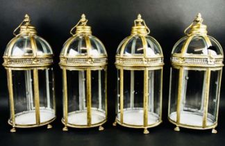 STORM LANTERNS, a set of four, gilt metal and glazed, Regency style, 46cm x 19cm x 19cm. (4)