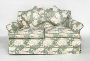 SOFA, traditional two seater with arched back, feather cushions and cord-trimmed floral loose