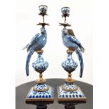 CANDLESTICKS, a pair, ceramic parrots with gilt mounts, 47cm H. (2)