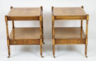 LAMP TABLES, a pair, Georgian style yewwood, each with slide and drawer below on brass castors, 60cm