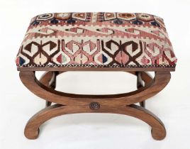 KELIM HEARTH STOOL, rectangular kelim upholstered raised upon Regency style mahogany cross supports,