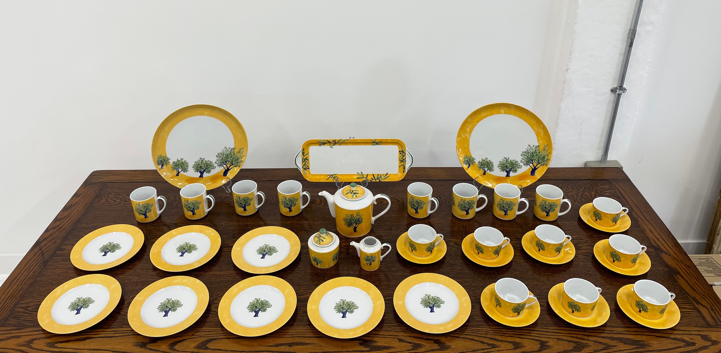 GUY DEGRENNE 'OULIVEIRO' EIGHT PLACE TEA SERVICE, including eight cups and saucers, eight mugs,