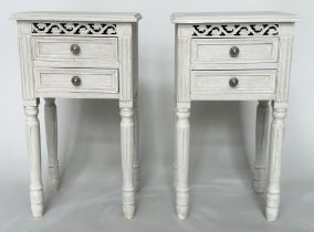 BEDSIDE CHESTS, a pair, French style traditionally grey painted each with pierced frieze and two
