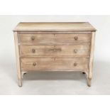 OAK CHEST, early 20th century Edwardian limed oak with three long drawers, central carved motif