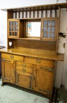 ARTS AND CRAFTS DRESSER, 202cm H x 160cm H x 51cm D, circa 1910, oak and brass with mirrored back