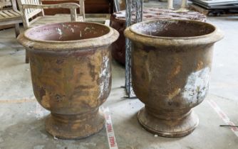 PLANTERS, a pair, terracotta in a vintage style weathered finish, 67cm H x 60cm. (2)