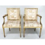 FAUTEUILS, a pair, 19th century giltwood each with down swept arms and carved fluted supports,