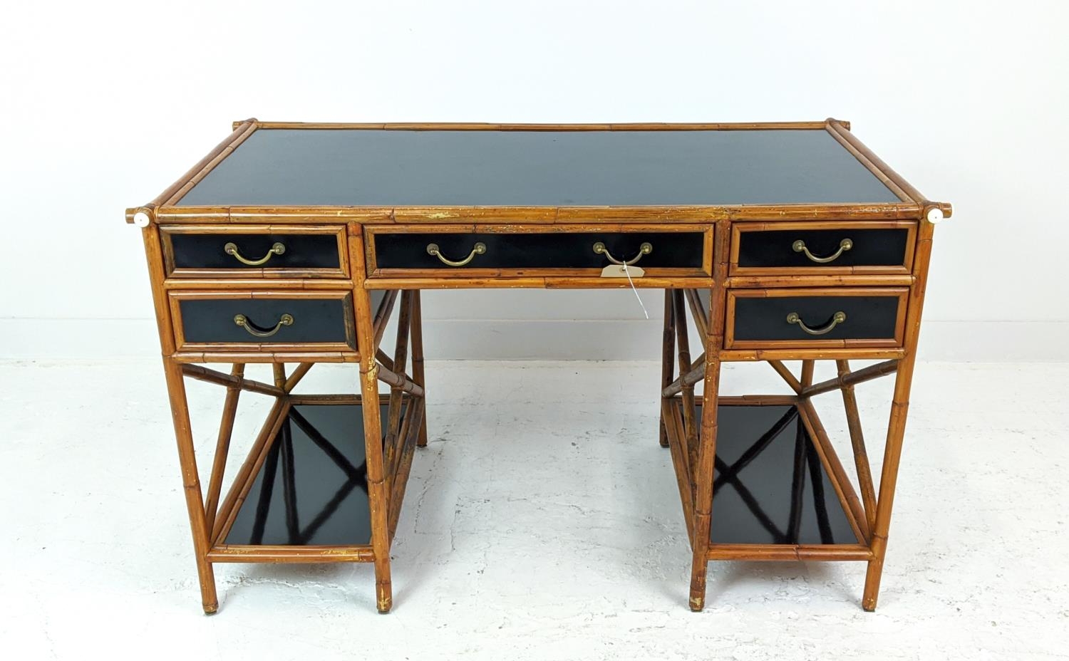 DESK, bamboo and black lacquer with five drawers, 128cm W x 77cm H x 68cm D.