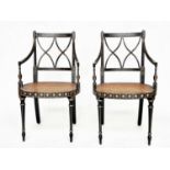 ARMCHAIRS, a pair, Regency style black lacquered and gilt painted with lattice backs and cane seats,