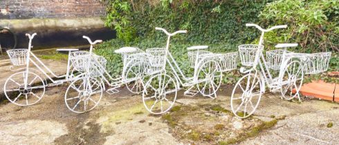 BICYCLE PLANTERS, a set of four, white painted metal, 63cm H x 88cm x 44cm. (4)