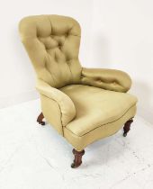 GILLOW ARMCHAIR, Victorian walnut in buttoned upholstery on brass castors (stamped and numbered