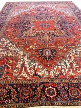 ANTIQUE PERSIAN HERIZ CARPET, 375cm x 277cm.