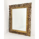 FLORENTINE MIRROR, 19th century Italian rectangular carved giltwood pierced frame, 83cm x 66cm.