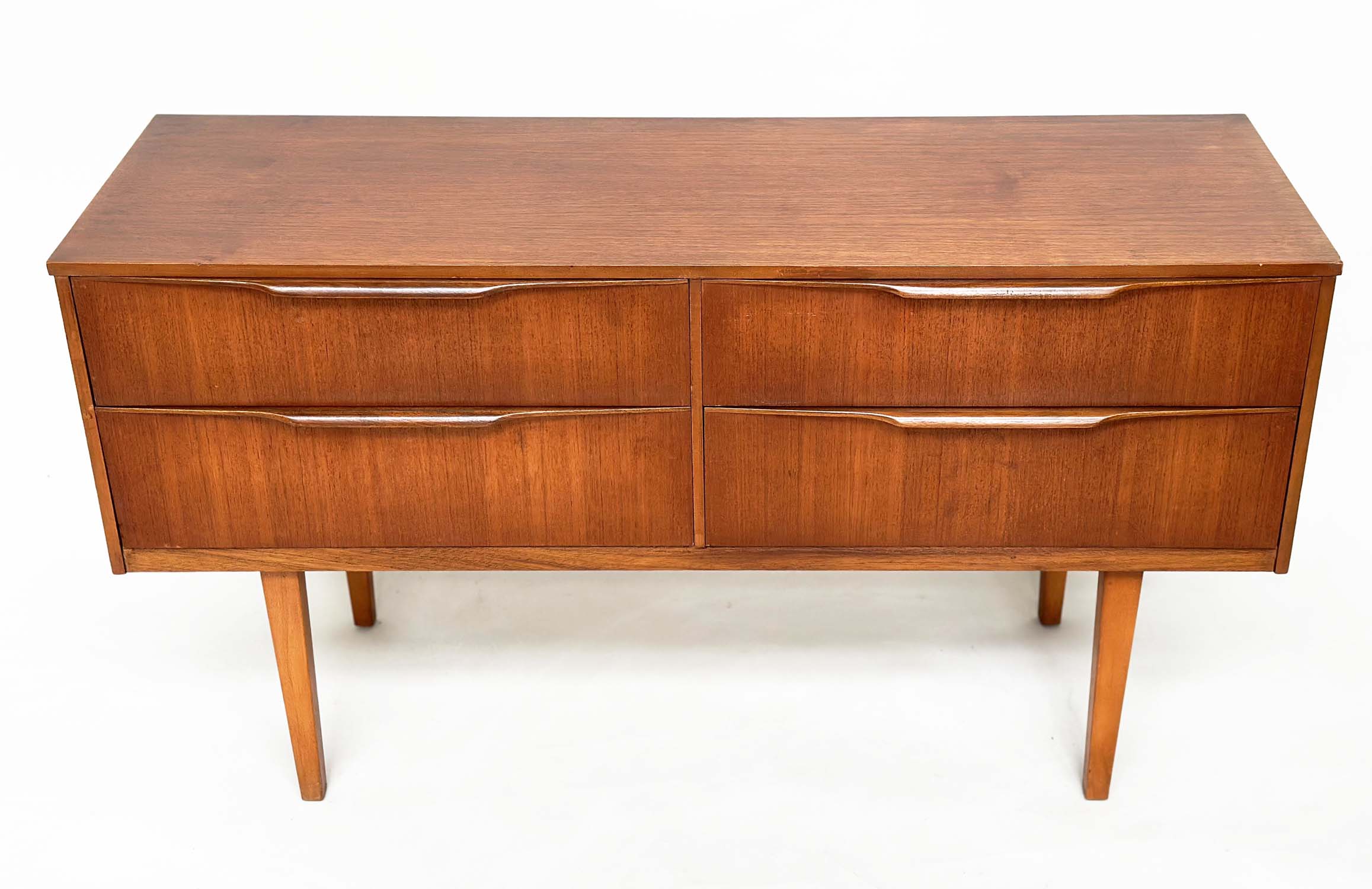 AUSTIN SUITE LOW CHEST, 1970s teak with four drawers, 128cm W x 70cm H x 41cm D. - Image 2 of 11