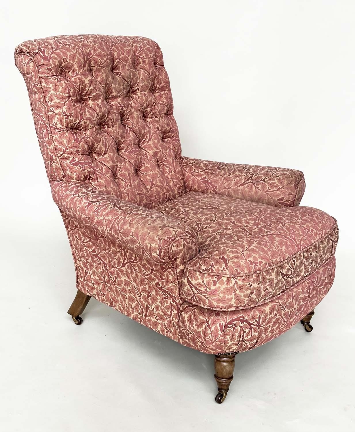 HOWARD STYLE ARMCHAIR, with button back, scroll arms, feather cushion and turned front supports