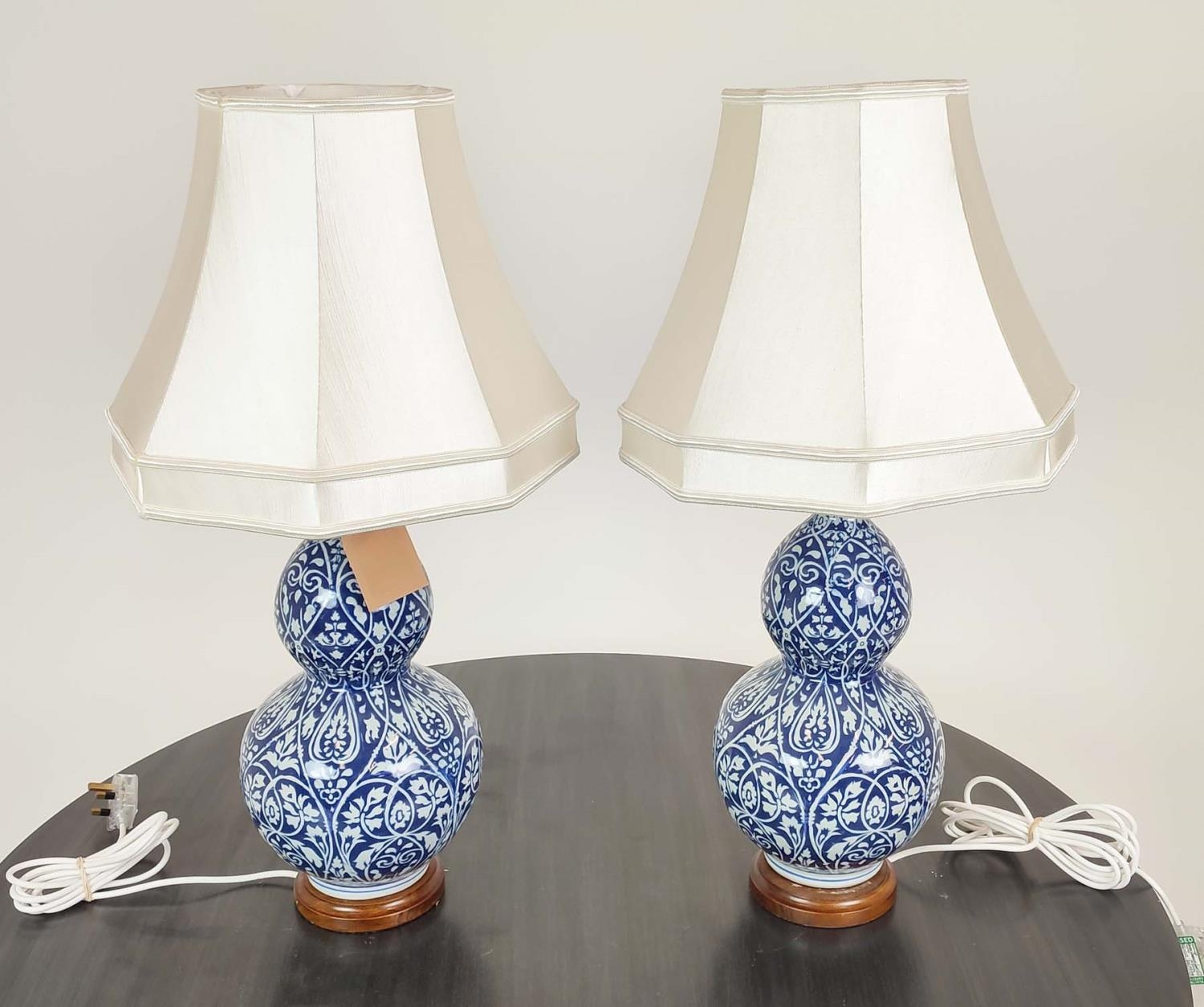 LAUREN RALPH LAUREN HOME TABLE LAMPS, a pair, blue and white double gourd ceramic, with shades, 72cm