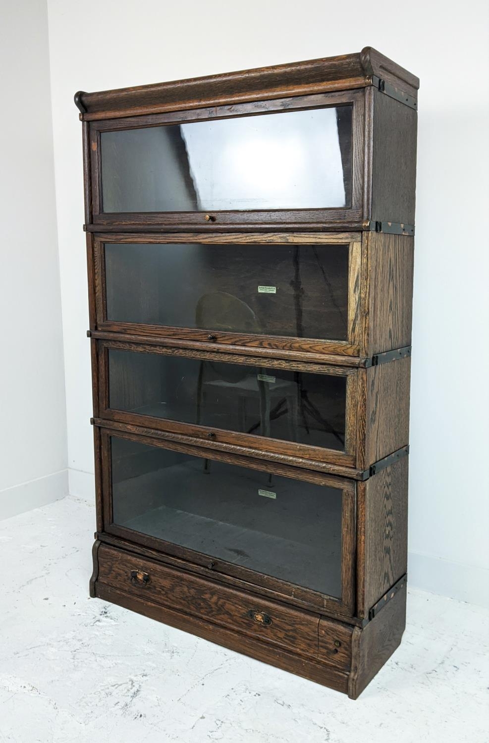 GLOBE WERNICKE BOOKCASE, early 20th century oak, four tier with glazed doors and drawer to base,