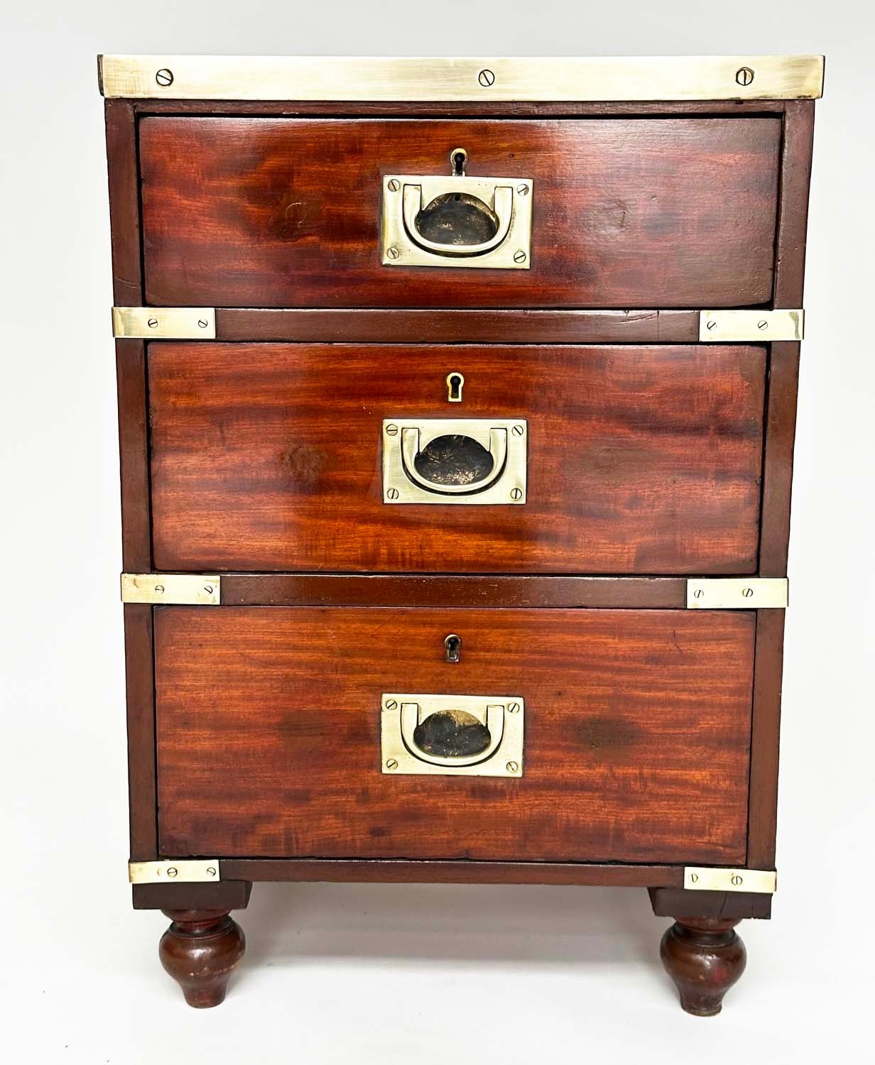 CAMPAIGN CHESTS, a pair, mahogany and brass bound each with three drawers and turned supports, - Image 4 of 10
