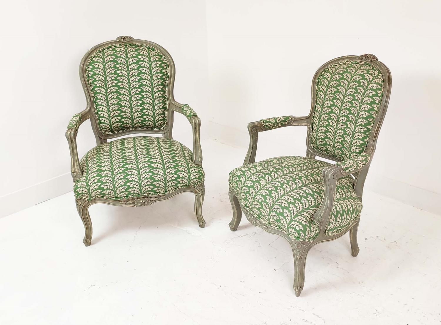 FAUTEUILS, a pair, Louis XV style, grey painted with green leaf patterned upholstery, 92cm H x