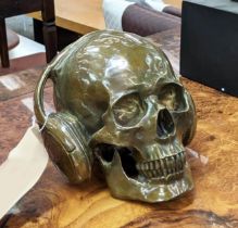 CONTEMPORARY SCHOOL SCULPTURAL STUDY, DJ skull, bronzed metal, 17cm H.