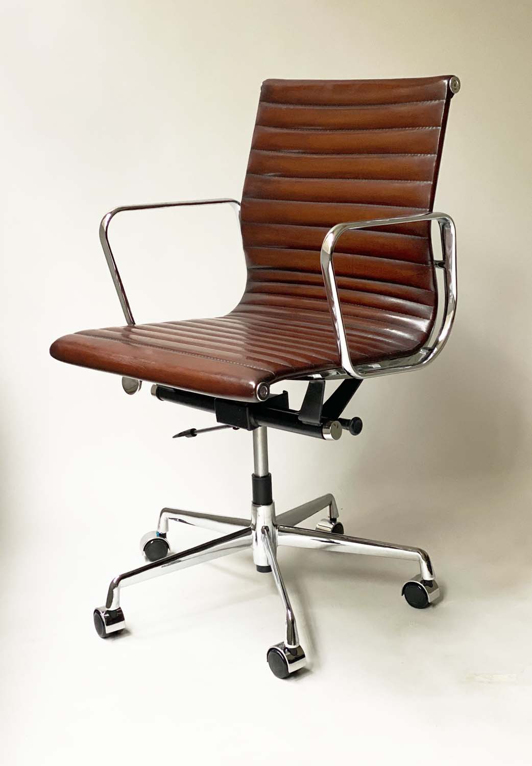 REVOLVING DESK CHAIR, Charles and Ray Eames inspired, with ribbed natural tan leather upholstered