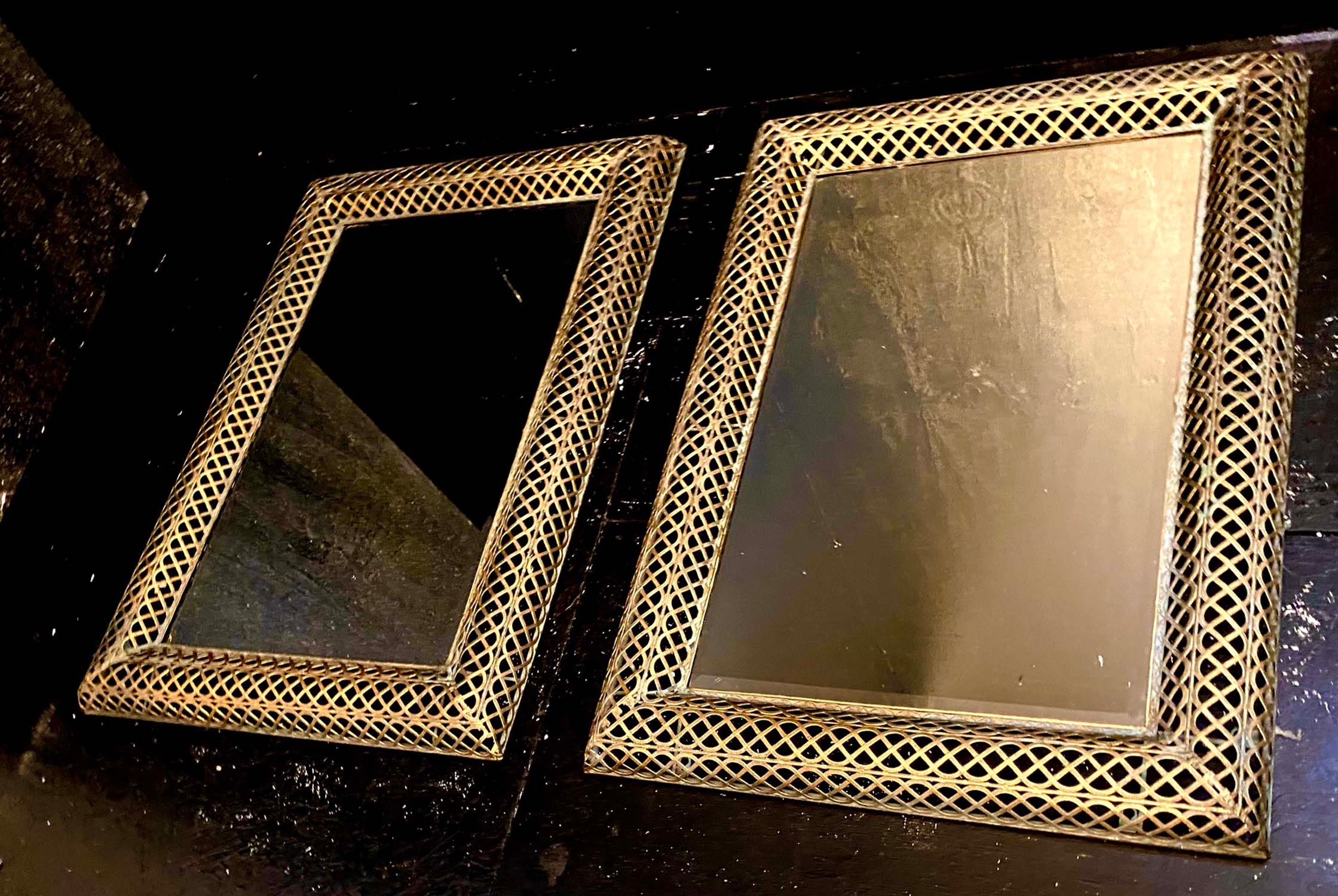 ARCHITECTURAL WALL MIRRORS, a pair, rectangular with pierced gilt metal frames, 100cm H x 70cm. (2)