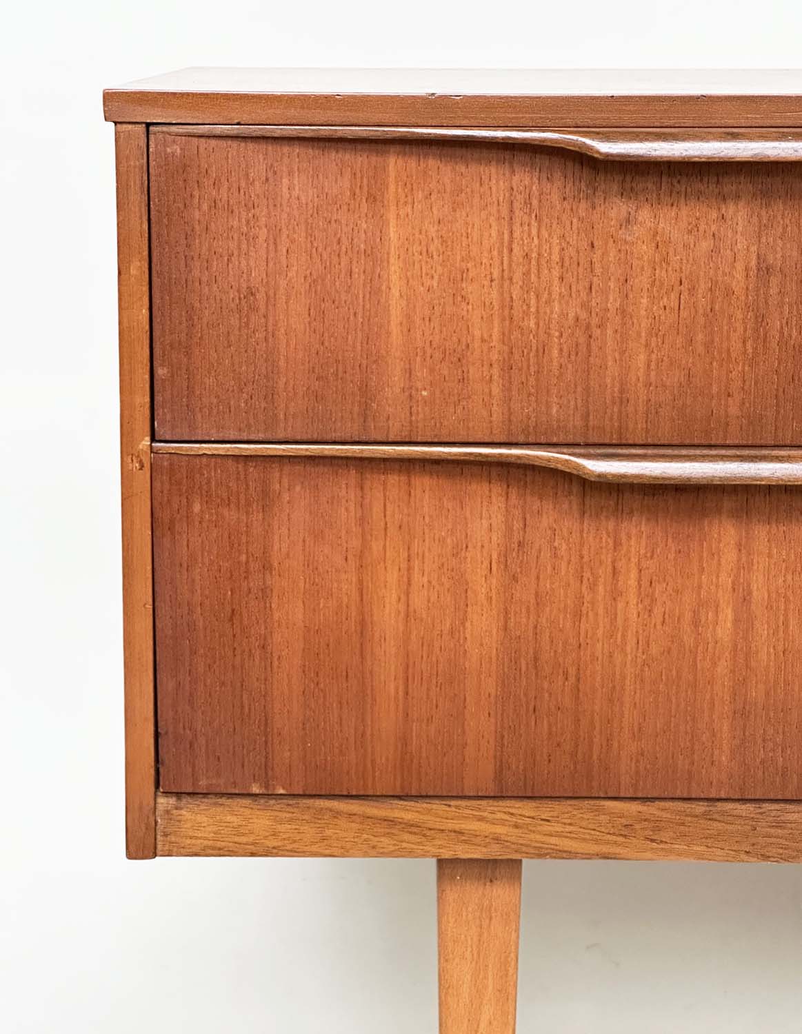 AUSTIN SUITE LOW CHEST, 1970s teak with four drawers, 128cm W x 70cm H x 41cm D. - Image 5 of 11