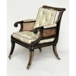 LIBRARY BERGERE BY JULIAN CHICHESTER, Regency style ebonised, gilt heightened and caned, 58cm W.