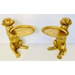 DOG SIDE TABLES, a pair, in a gilt finish, 43cm H x 27cm x 38cm. (2)