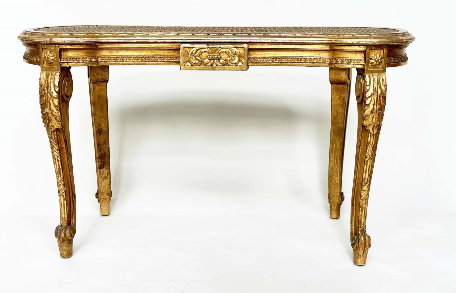 WINDOW SEAT, late 19th century French Louis XVI style giltwood with cane seat and carved tapering