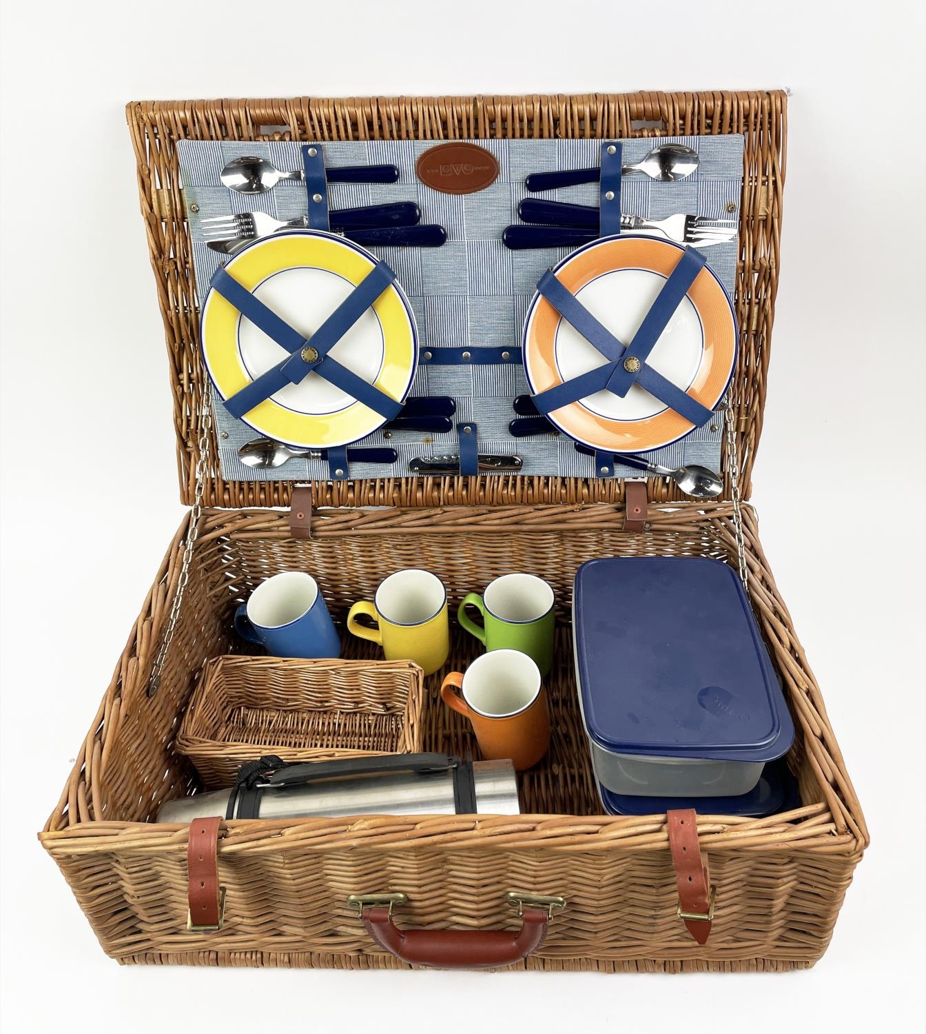 G.T.C. PICNIC BASKET, four place setting, including plates, cutlery, mugs, flask and tuperware in