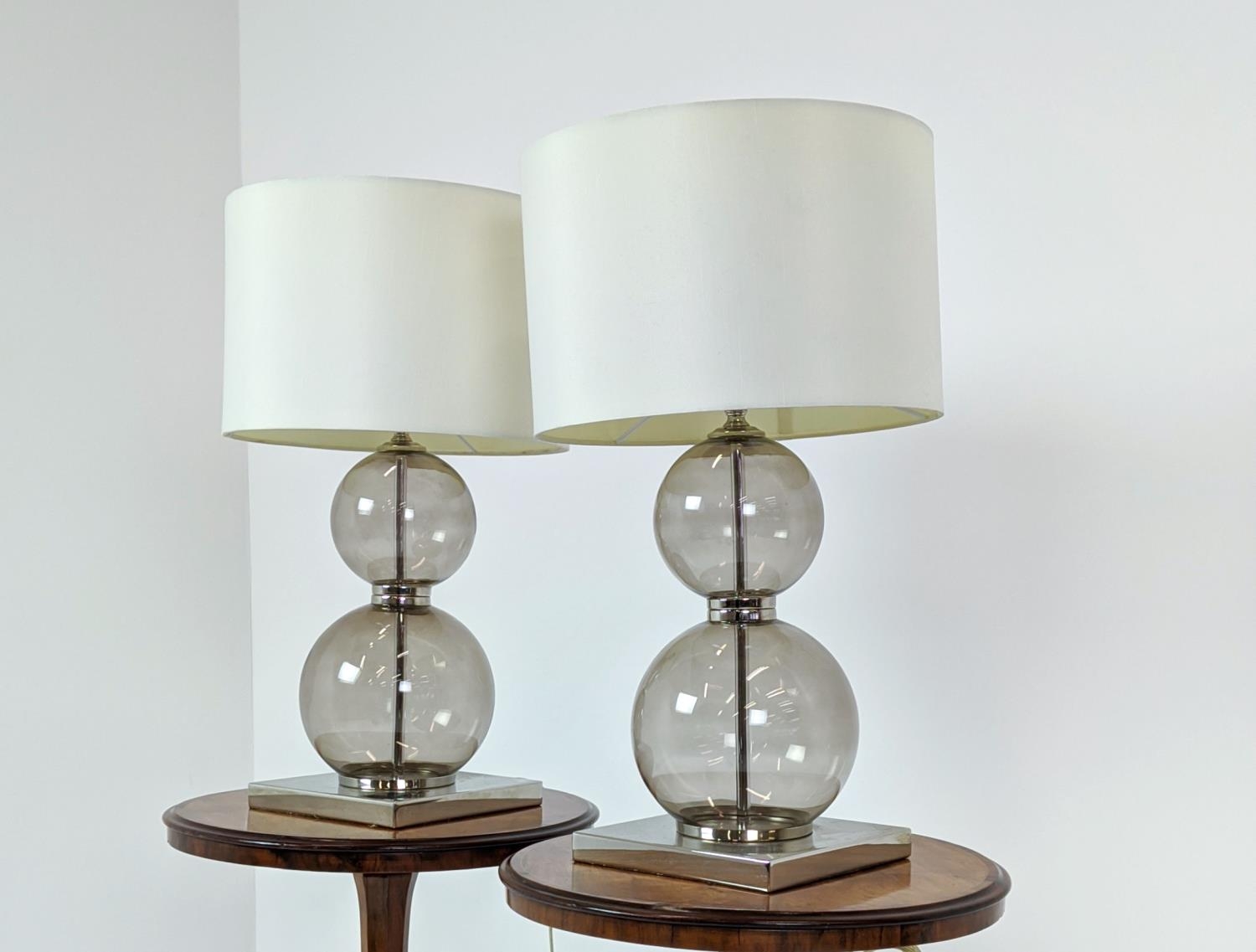 TABLE LAMPS, a pair, glass ball stems on square polished metal bases, 61cm H x 35cm W in shades. (2) - Image 3 of 6