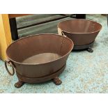 PLANTERS, a pair, oval form in cast metal, 73cm L x 60cm W x 33cm H. (2)